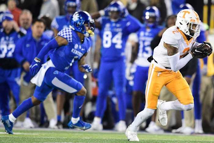 Tennessee defensive back Alontae Taylor (2) intercepts a pass intended for Kentucky receiver Wan'Dale Robinson (1) and returns it for a touchdown. Calvin Mattheis/News Sentinel / USA TODAY NETWORK